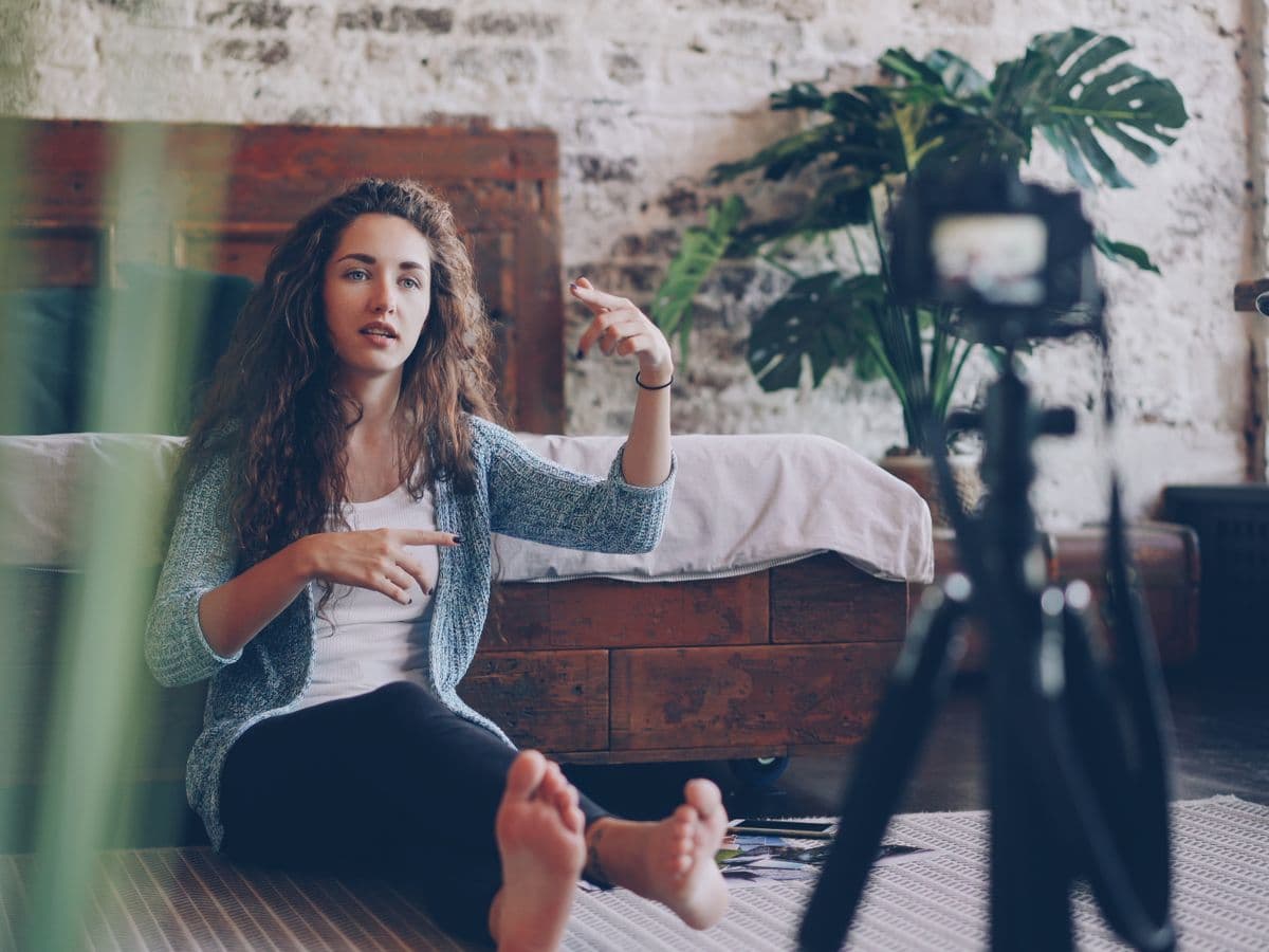 Creator filming a video at home